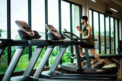 man on treadmill looking out window