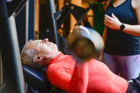 man with weights in hands